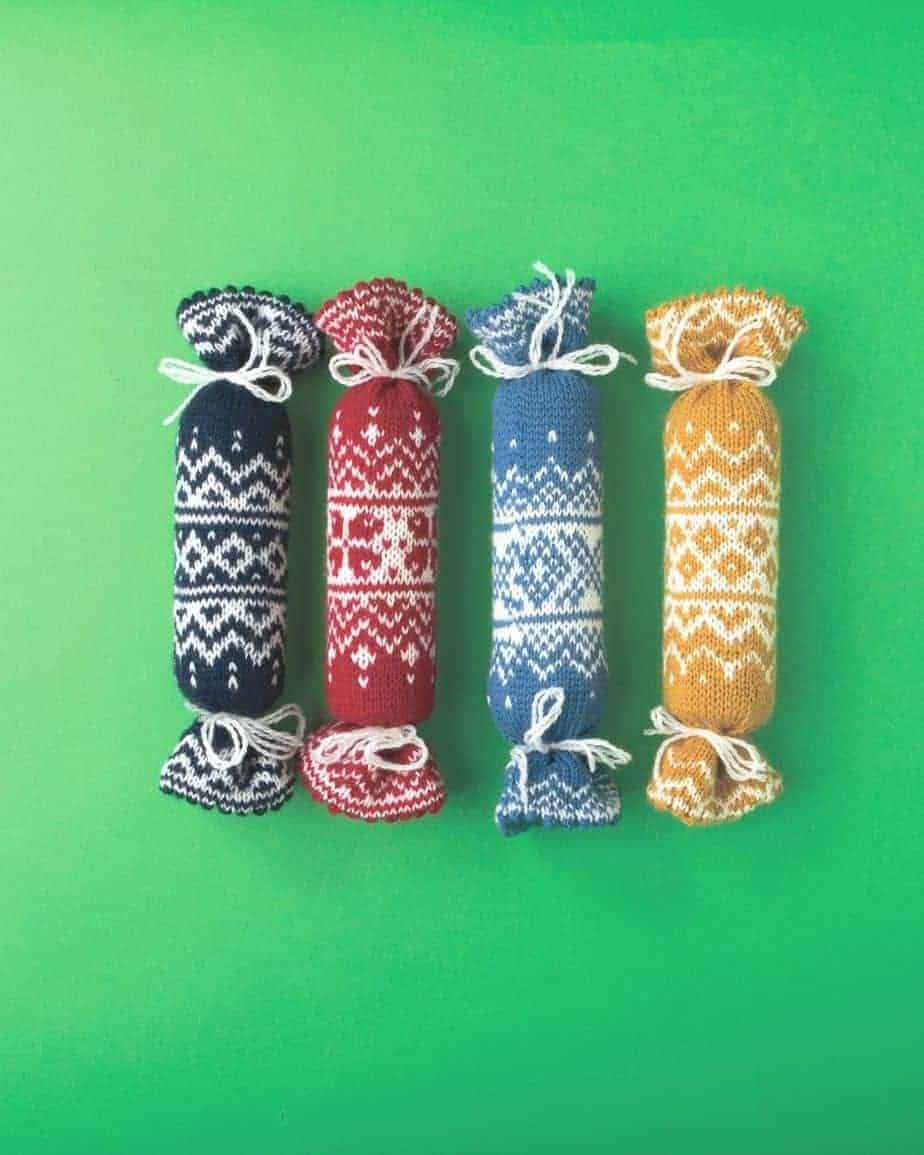 Knitted Norwegian Chrsitmas Crackers on green background