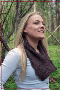 Woman in the woods wearing a lace knit cowl